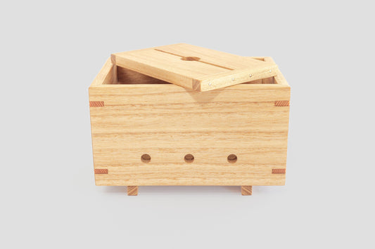 Wooden tofu press, made by Tofu Press Australia, with lid of top. Front view.