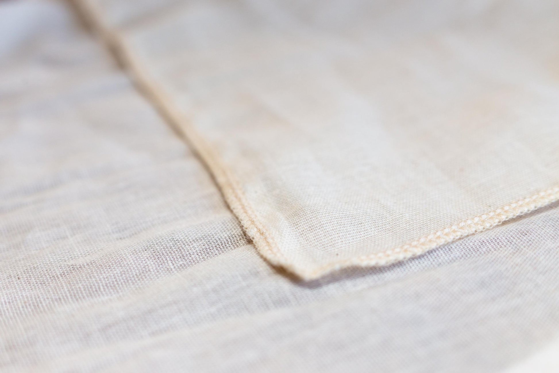 Close up of hemmed natural, food-safe muslin cloth for soy milk straining and tofu making.