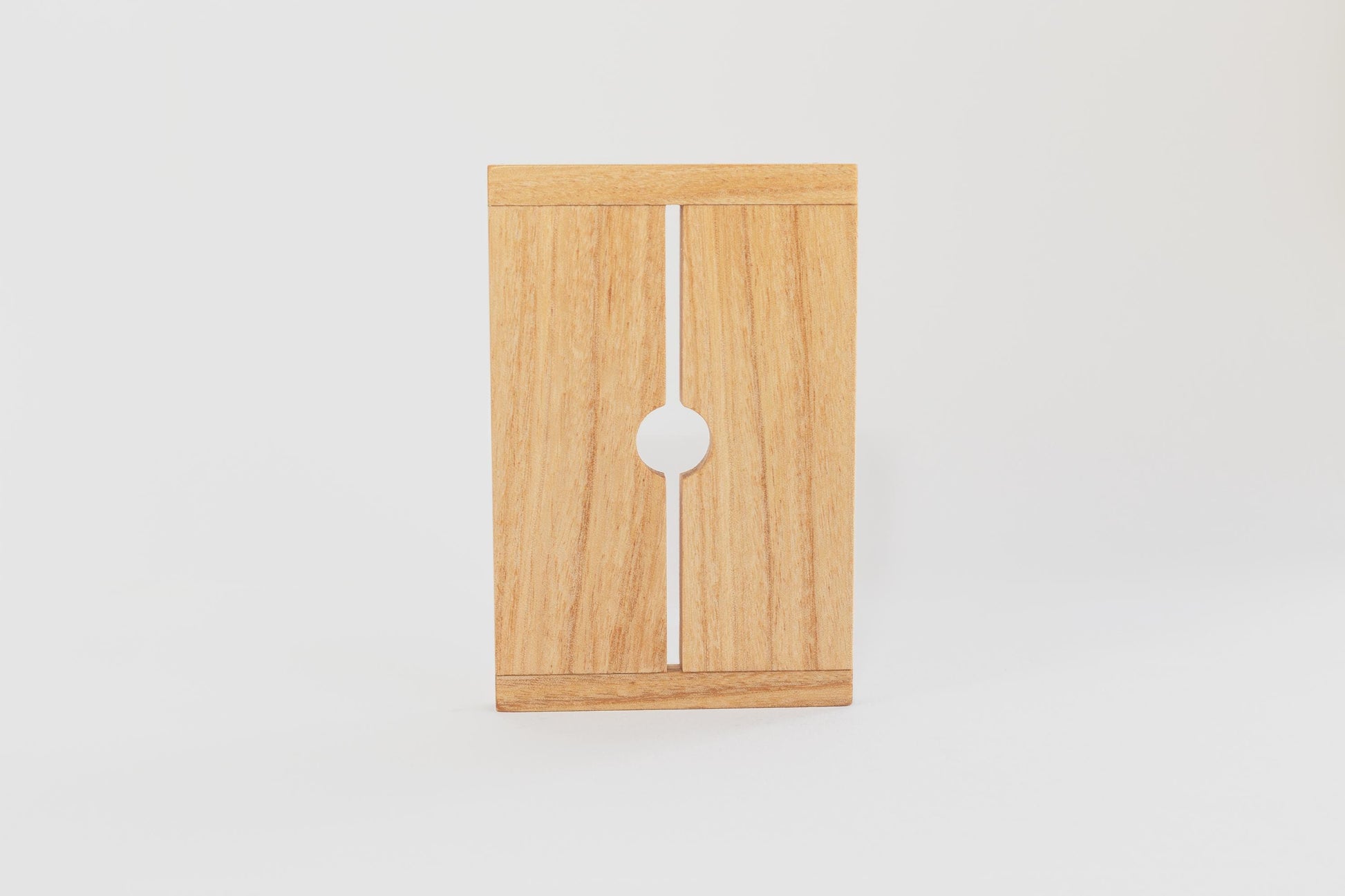 Close up of wooden tofu press lid from Tofu Press Australia on a white background.