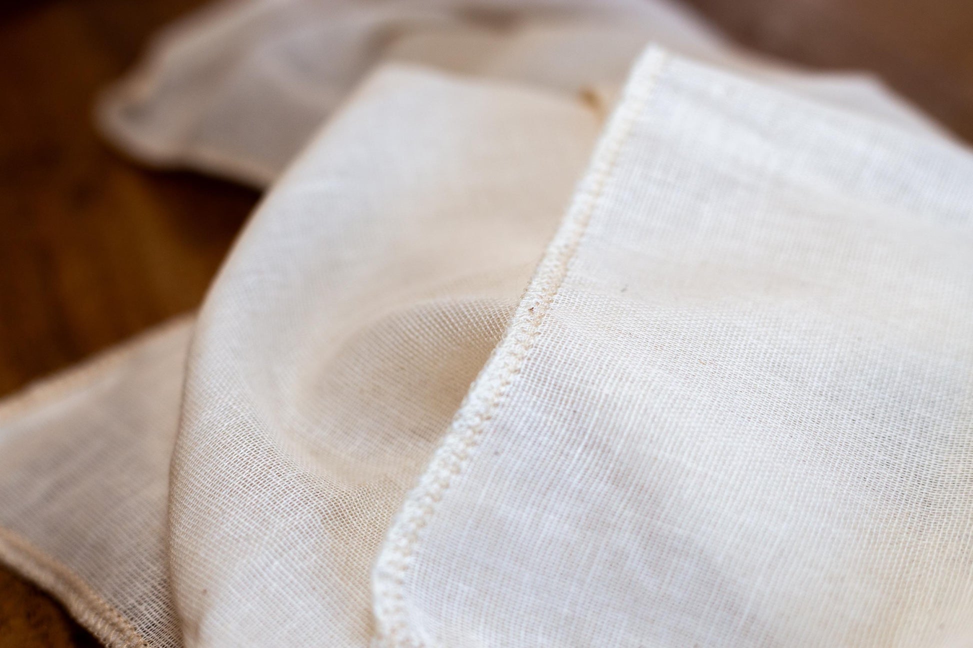 Close up of hemmed natural, food-safe muslin cloth for soy milk straining and tofu making.