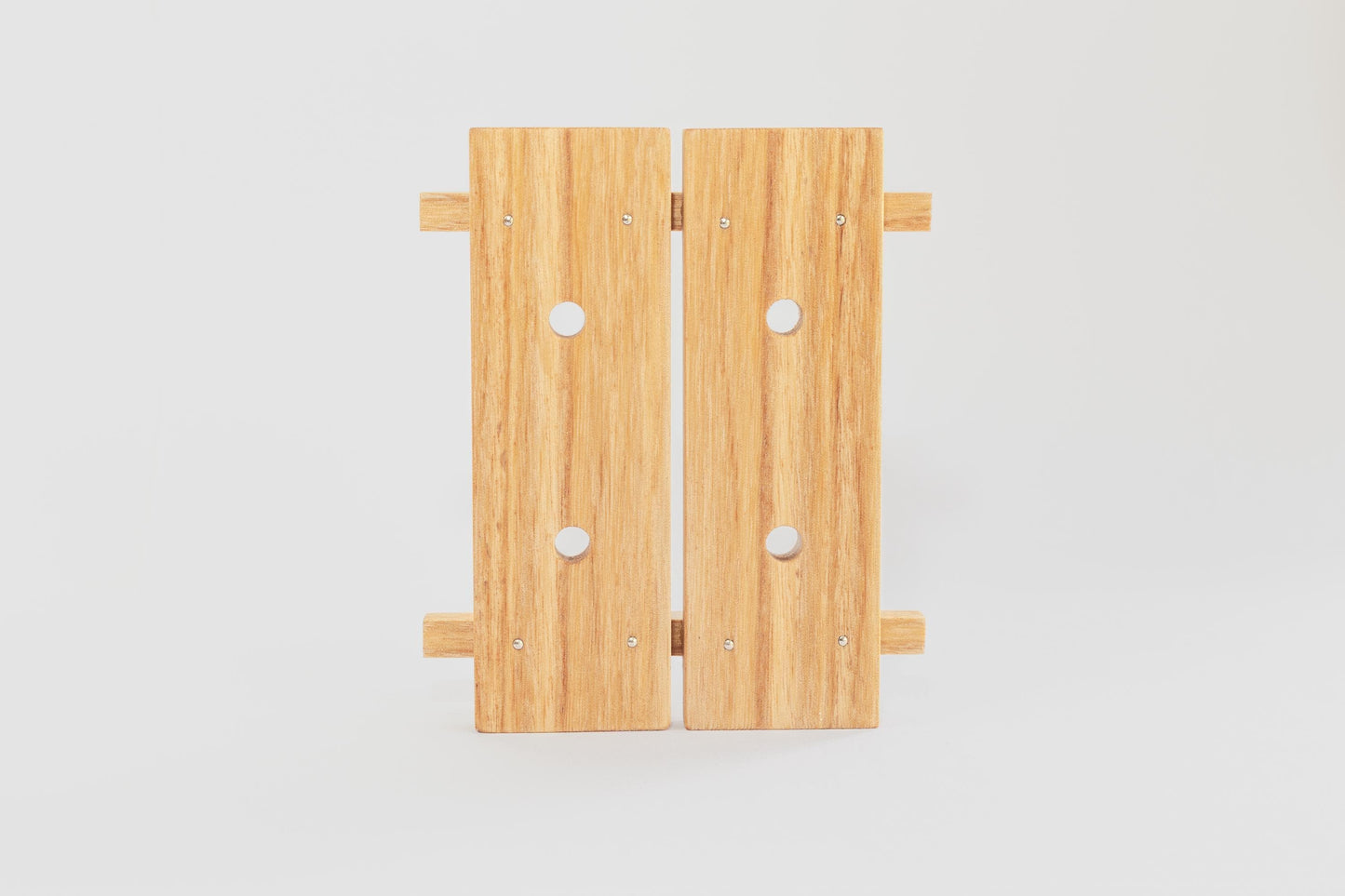 Close up of wooden tofu press base from Tofu Press Australia on a white background.